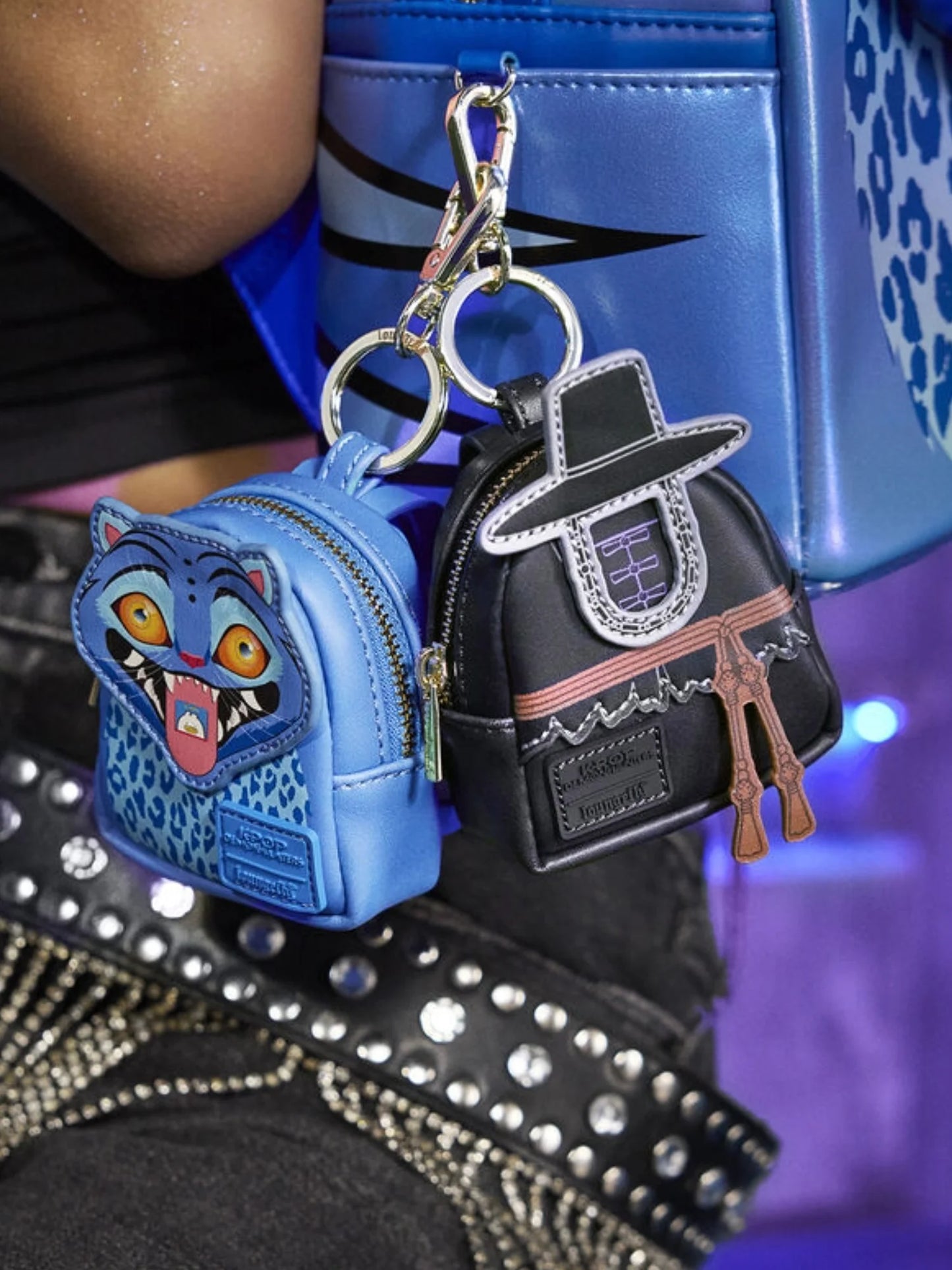 Close-up of the Derpy the Tiger mini backpack keychain with blue glitter finish and playful face detail