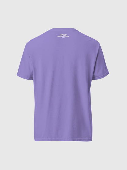 A fan wearing the oversized HUNTR/X tour shirt at a concert, showcasing the relaxed comfort-colors fit
